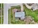Overhead shot reveals a perfectly landscaped property with mature trees and a quaint outdoor patio, set in a peaceful locale at 1716 Teakwood Ct, Lafayette, IN 47905