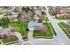 Aerial view of charming home with blue siding, mature landscaping, and a long driveway at 1716 Teakwood Ct, Lafayette, IN 47905