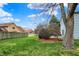 Well-maintained backyard featuring green grass, mature trees, and a patio at 1716 Teakwood Ct, Lafayette, IN 47905