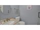 Well-lit bathroom featuring a stylish sink and toilet at 1716 Teakwood Ct, Lafayette, IN 47905