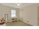 Bright bedroom with neutral carpet, a classic desk area, and a double door closet at 1716 Teakwood Ct, Lafayette, IN 47905