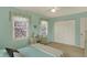 Light-filled bedroom with pale green walls, carpet flooring, and a double window for ample natural light at 1716 Teakwood Ct, Lafayette, IN 47905
