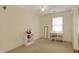 Cozy bedroom with neutral carpet, a modern mirror, and a comfortable desk area at 1716 Teakwood Ct, Lafayette, IN 47905