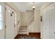 Spacious foyer with a staircase, wood flooring, and a white door at 1716 Teakwood Ct, Lafayette, IN 47905