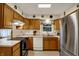 Spacious kitchen with updated stainless steel appliances and wooden cabinets at 1716 Teakwood Ct, Lafayette, IN 47905