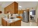 Well-lit kitchen with stainless steel refrigerator and light countertops at 1716 Teakwood Ct, Lafayette, IN 47905