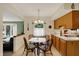 Charming eat-in kitchen area featuring tile floors and a view to living room at 1716 Teakwood Ct, Lafayette, IN 47905