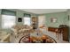 Cozy living room with natural light, floral sofa, and a decorative area rug at 1716 Teakwood Ct, Lafayette, IN 47905