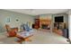 Comfortable living room showcases carpet, fireplace and many seating options at 1716 Teakwood Ct, Lafayette, IN 47905