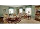 Bright living room featuring classic furnishings, a round rug, and soft green walls at 1716 Teakwood Ct, Lafayette, IN 47905