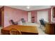 Bright living room with neutral carpet, pink walls, ceiling fan, and door to the closet at 1716 Teakwood Ct, Lafayette, IN 47905