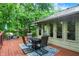 Outdoor living on a spacious deck with patio table, chairs and umbrella perfect for dining alfresco at 2143 Sunderland Dr, Martinsville, IN 46151