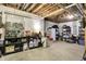 Unfinished basement offers exposed beams, storage shelves and space for flexible living and storage solutions at 2143 Sunderland Dr, Martinsville, IN 46151