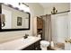 Bathroom with wood cabinet, anchor decor, mirror, and shower at 2143 Sunderland Dr, Martinsville, IN 46151