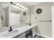 Bright bathroom with double sinks, large mirror, and decorative wreaths at 2143 Sunderland Dr, Martinsville, IN 46151