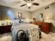Cozy bedroom with a queen bed, dresser, and warm lighting at 2143 Sunderland Dr, Martinsville, IN 46151