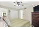 Bedroom with large bed, TV, ceiling fan and closet at 2143 Sunderland Dr, Martinsville, IN 46151