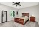 Well lit bedroom with a carpeted floor, ceiling fan, and double hung windows at 2143 Sunderland Dr, Martinsville, IN 46151