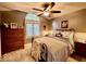 Comfortable bedroom with arched window, ceiling fan, and a decorative bed frame at 2143 Sunderland Dr, Martinsville, IN 46151