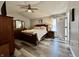 Bright bedroom with hardwood floors and natural light streaming through a large window at 2143 Sunderland Dr, Martinsville, IN 46151