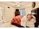 Bedroom with colorful bedding, carpet flooring, and natural light at 2143 Sunderland Dr, Martinsville, IN 46151