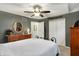 Neutral bedroom with dresser, ceiling fan, closet, and carpet floors at 2143 Sunderland Dr, Martinsville, IN 46151