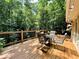 Large deck area surrounded by lush greenery, offering privacy and a connection with nature at 2143 Sunderland Dr, Martinsville, IN 46151
