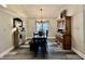 Dining room features a chandelier, a table with a bench, a hutch, and a window with neutral colors at 2143 Sunderland Dr, Martinsville, IN 46151