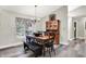 Inviting dining room with wood table, chandelier and modern wood flooring at 2143 Sunderland Dr, Martinsville, IN 46151