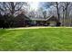 Charming brick home with manicured lawn and mature trees at 2143 Sunderland Dr, Martinsville, IN 46151