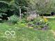 Lush garden area with diverse plants and decorative elements for a picturesque backyard at 2143 Sunderland Dr, Martinsville, IN 46151