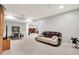 Relaxing living room with neutral walls, carpet, and a cozy brown couch with pillows at 2143 Sunderland Dr, Martinsville, IN 46151