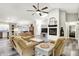 Bright living room features fireplace, skylight, modern flooring, and open floorplan at 2143 Sunderland Dr, Martinsville, IN 46151