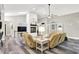 Sunlit living room featuring a cozy fireplace and modern flooring at 2143 Sunderland Dr, Martinsville, IN 46151
