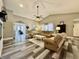 Spacious living room with vaulted ceilings, ceiling fan, and comfortable neutral-toned furniture at 2143 Sunderland Dr, Martinsville, IN 46151