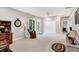 Bright living room featuring neutral walls, carpet flooring, and a large clock at 2143 Sunderland Dr, Martinsville, IN 46151