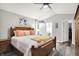 Bright main bedroom with wooden furniture and view into ensuite bathroom and walk-in closet at 2143 Sunderland Dr, Martinsville, IN 46151
