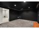 Theater room with black walls, ceiling, and carpet flooring at 2143 Sunderland Dr, Martinsville, IN 46151