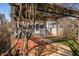 Backyard featuring a brick patio and a charming pergola covered with climbing vines at 2309 Pearl St, Columbus, IN 47201