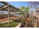 Well-maintained backyard featuring a brick patio, pergola, and a lush green lawn at 2309 Pearl St, Columbus, IN 47201