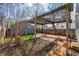 Charming backyard featuring a pergola-covered patio and fenced yard, perfect for outdoor entertaining at 2309 Pearl St, Columbus, IN 47201