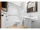 Bright bathroom with tiled shower and pedestal sink at 2309 Pearl St, Columbus, IN 47201