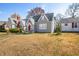 Charming two-story gray home with red door, well-kept lawn, and surrounding residential neighborhood at 2309 Pearl St, Columbus, IN 47201