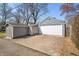 Exterior view of the detached garage with a shed and a driveway at 2309 Pearl St, Columbus, IN 47201