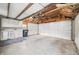 Interior view of a garage with white cabinets and door at 2309 Pearl St, Columbus, IN 47201