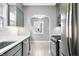 Stylish kitchen with gray cabinets, stainless steel appliances, and modern lighting fixtures at 2309 Pearl St, Columbus, IN 47201