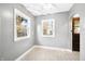 Well-lit living room featuring tile floors and an arched doorway at 2309 Pearl St, Columbus, IN 47201