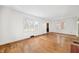 Bright living room featuring hardwood floors and large windows, providing ample natural light at 2309 Pearl St, Columbus, IN 47201