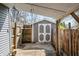 Backyard shed with double doors and ample storage, perfect for gardening equipment and tools at 2309 Pearl St, Columbus, IN 47201