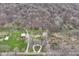 Aerial view of the house, red barn, second building, and winding driveways at 2420 Goose Creek Rd, Martinsville, IN 46151
